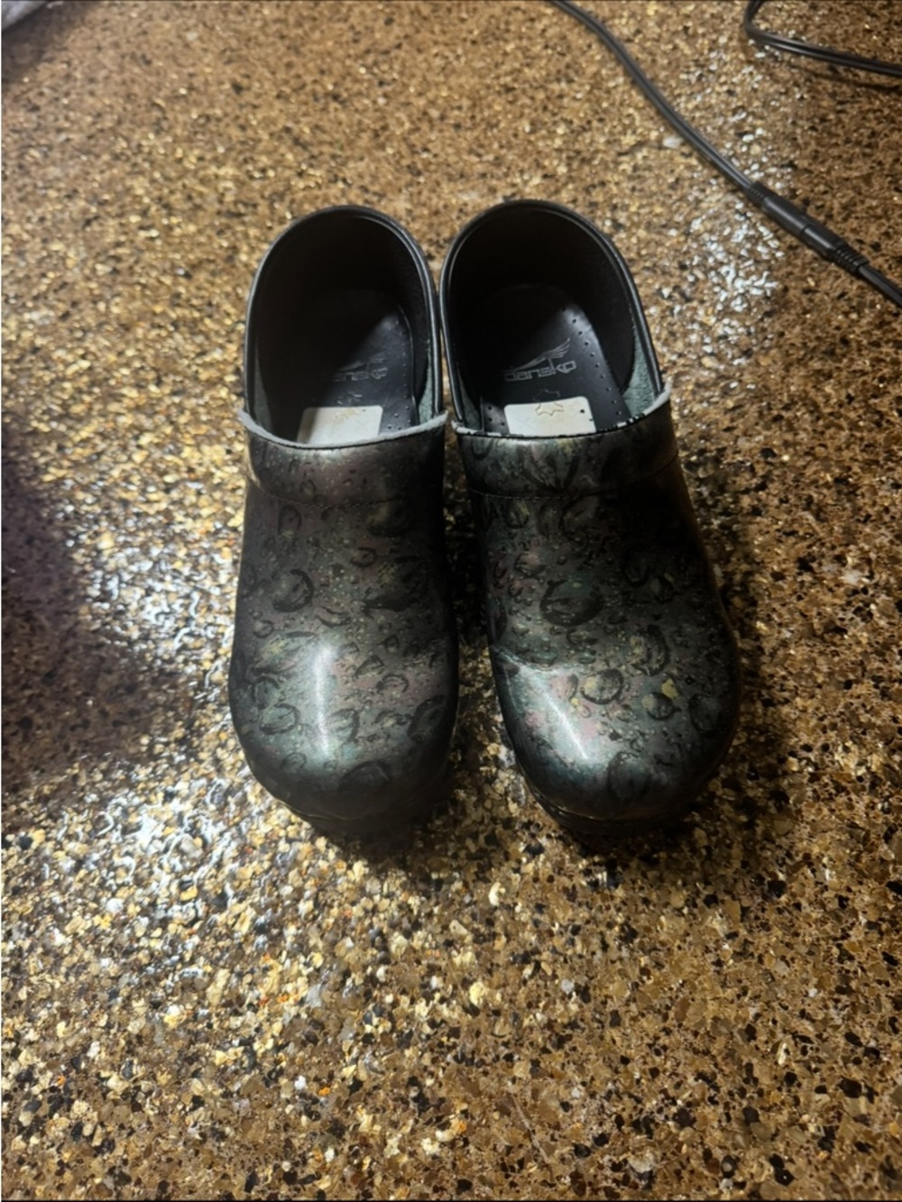 Dansko Women's Iridescent Green-Black Floral Pattern Clogs